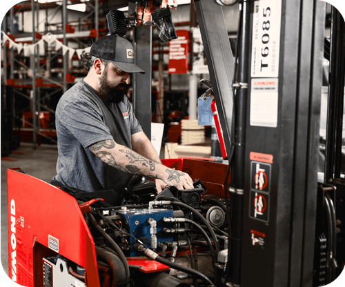 Tech working on forklift