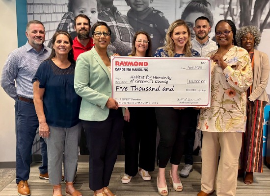 Carolina Handling associatespresents a $5,000 check to Habitat for Humanity of Greenville County.
