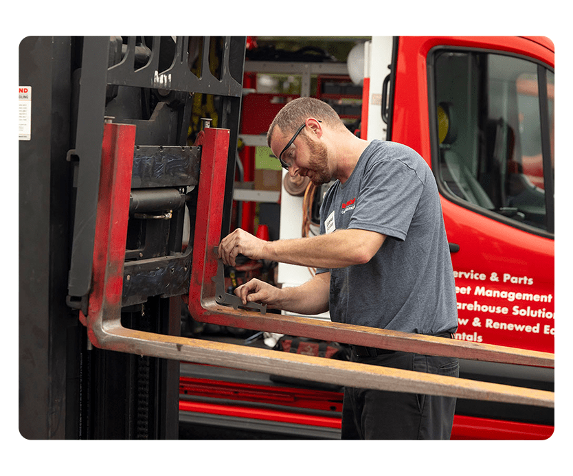 Carolina Handling Technician repairing Raymond Forklift
