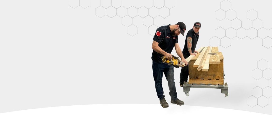 Carolina Handling associates cutting wood. 