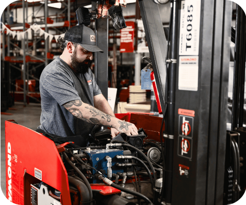 Carolina Handling Technician repairing a forklift.