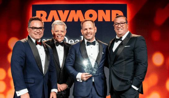 Carolina Handling accepts DOD award.