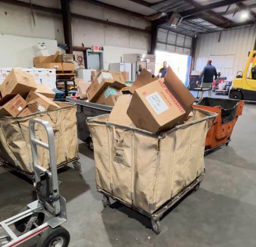 Before boxes in containers and a mess in warehouse. 